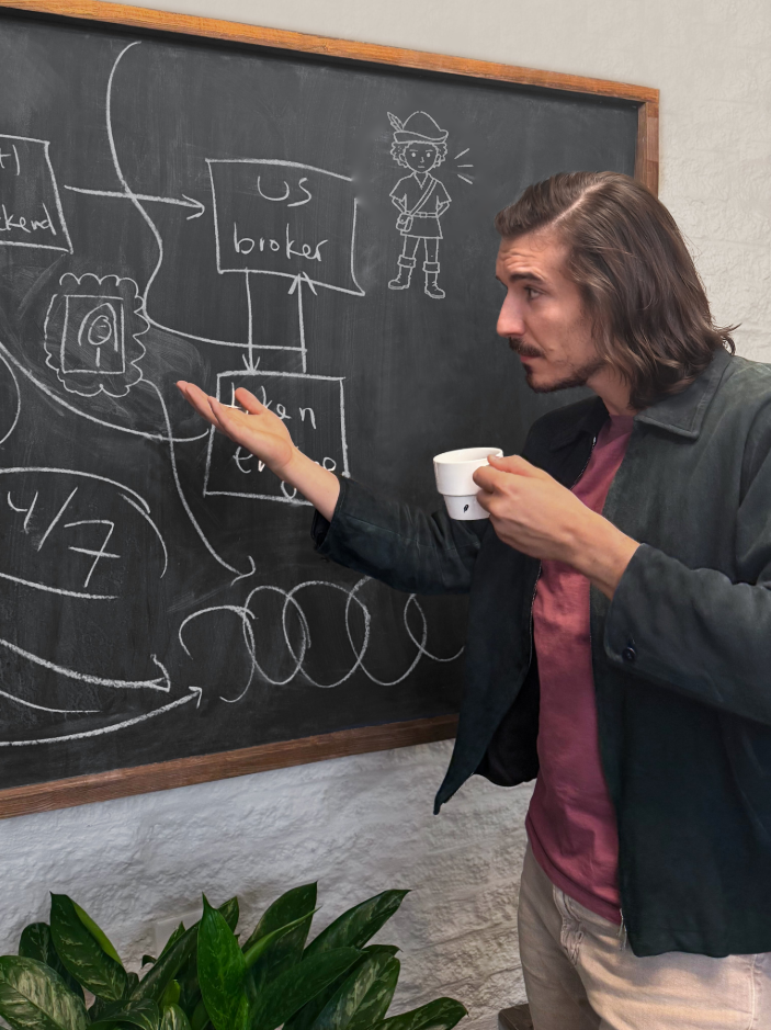 Community photo edit: a chalk drawing of Little Guy appears on the board beside Vlad Tenev.